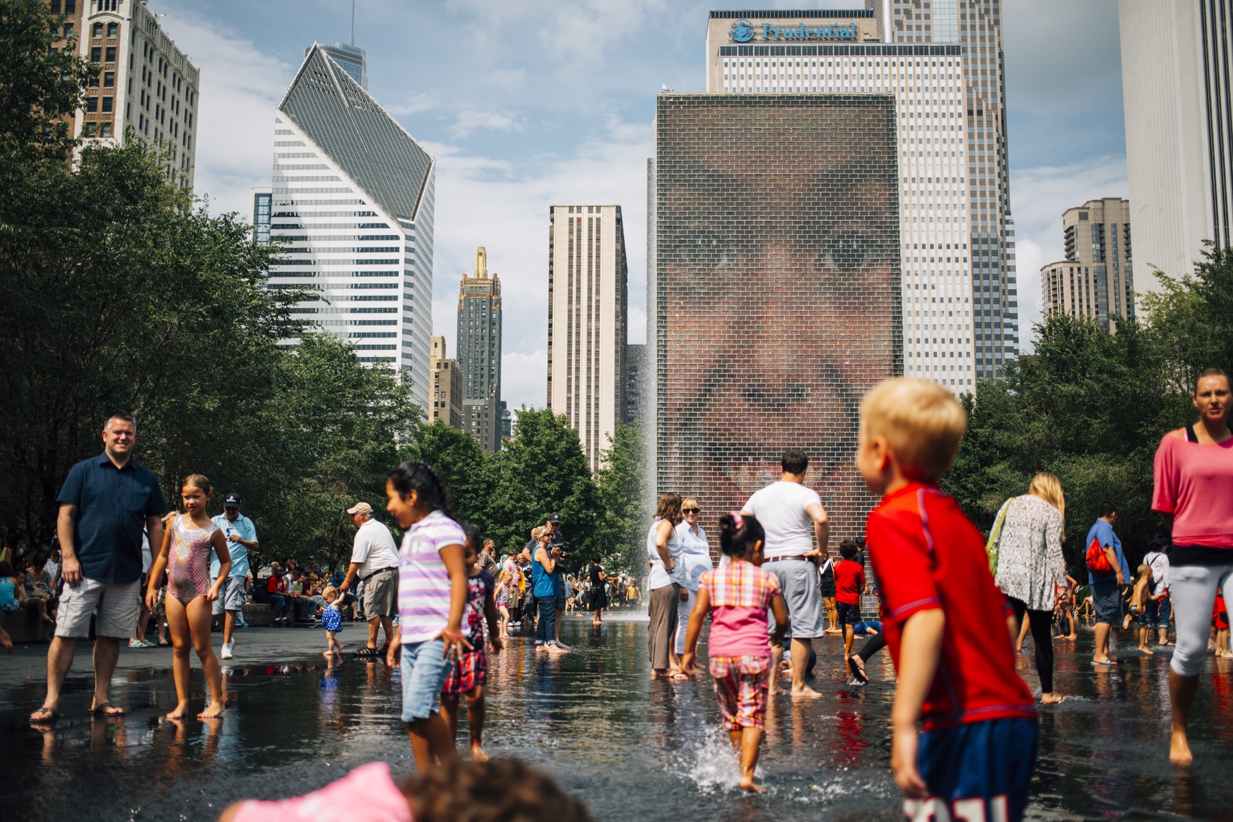 Families playing in Crown Fountain, Millennium Park