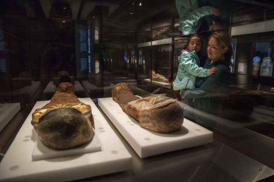 A mother and child look at a mummy in the Field Museum