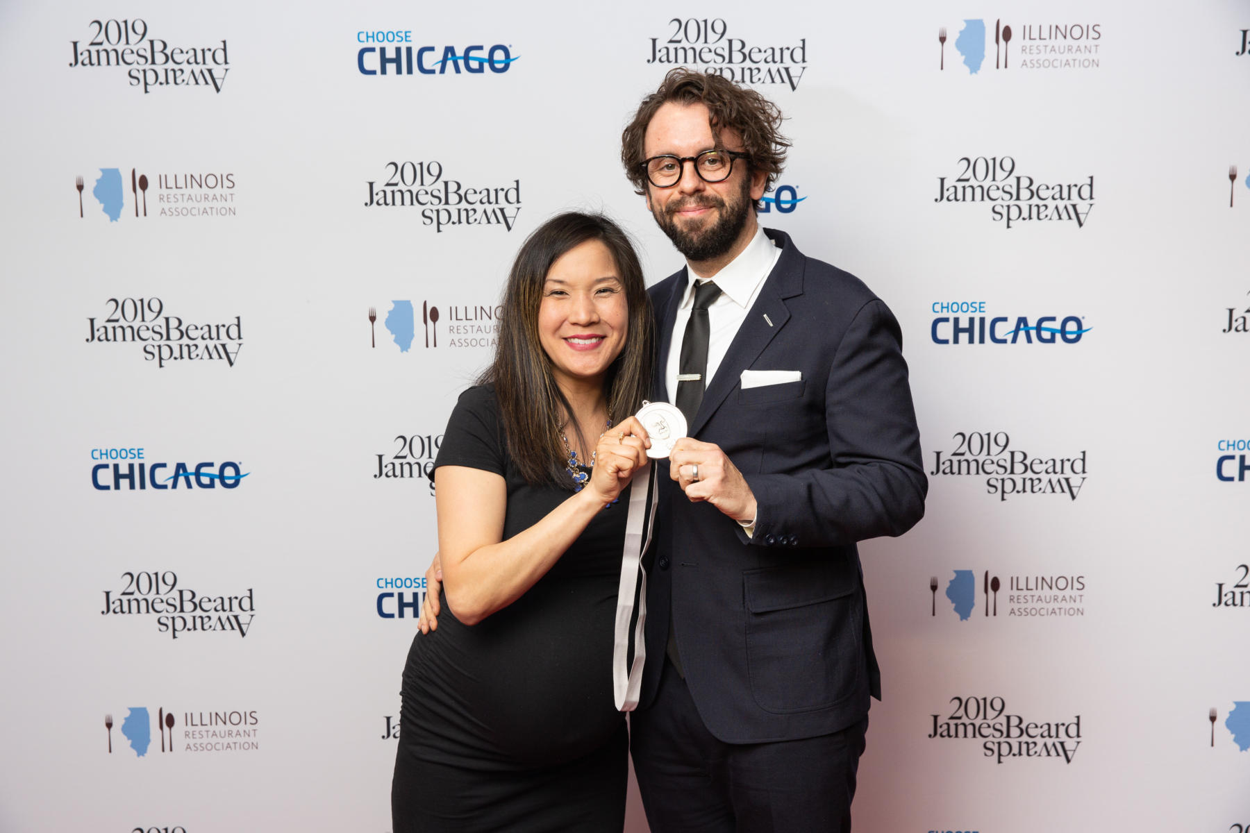 Beverly Kim and her husband with their James Beard Award