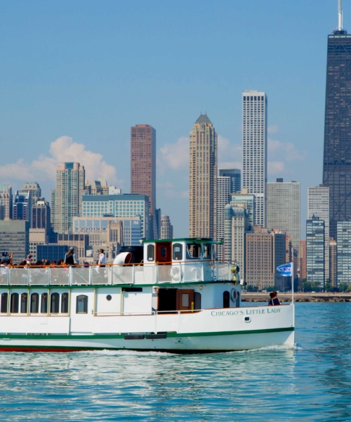 A vessel operated by Mercury, Chicago’s Skyline Cruiseline cruises in Lake Michigan with the Chicago skyline in the background