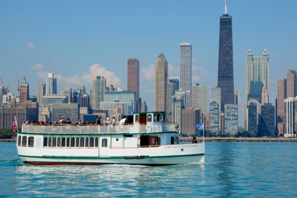 A vessel operated by Mercury, Chicago’s Skyline Cruiseline cruises in Lake Michigan with the Chicago skyline in the background