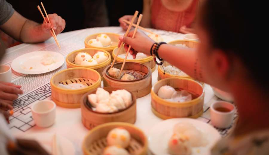 People sharing dumplings in Chinatown