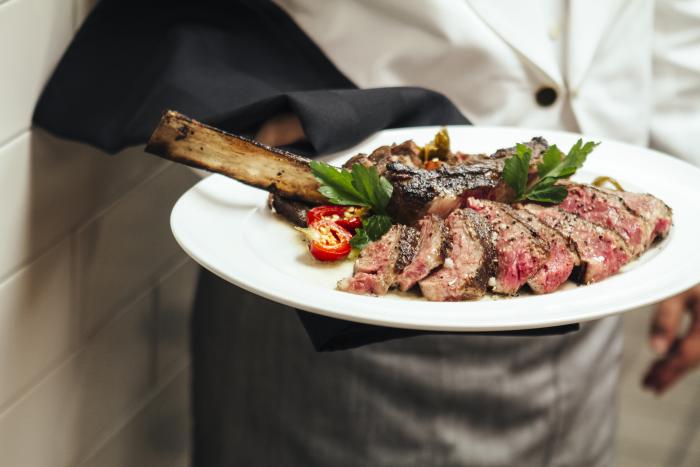 Steak being served