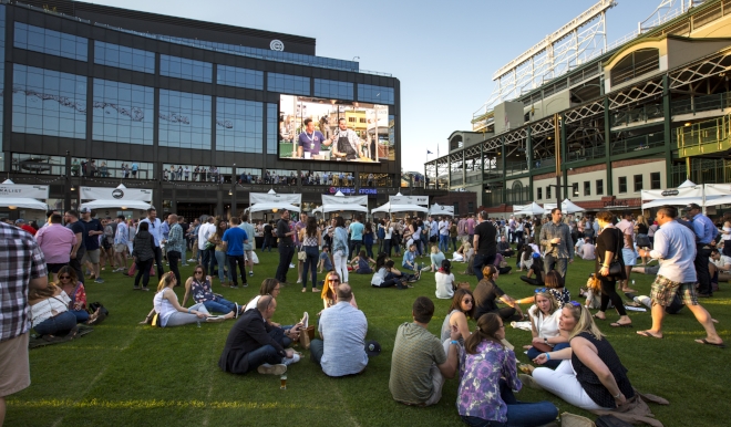 View of the greenspace and tv screen next to Wrigley Field.