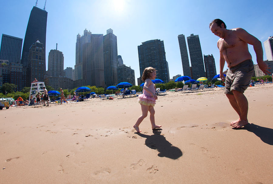 Father and daughter on a beach in Chicago