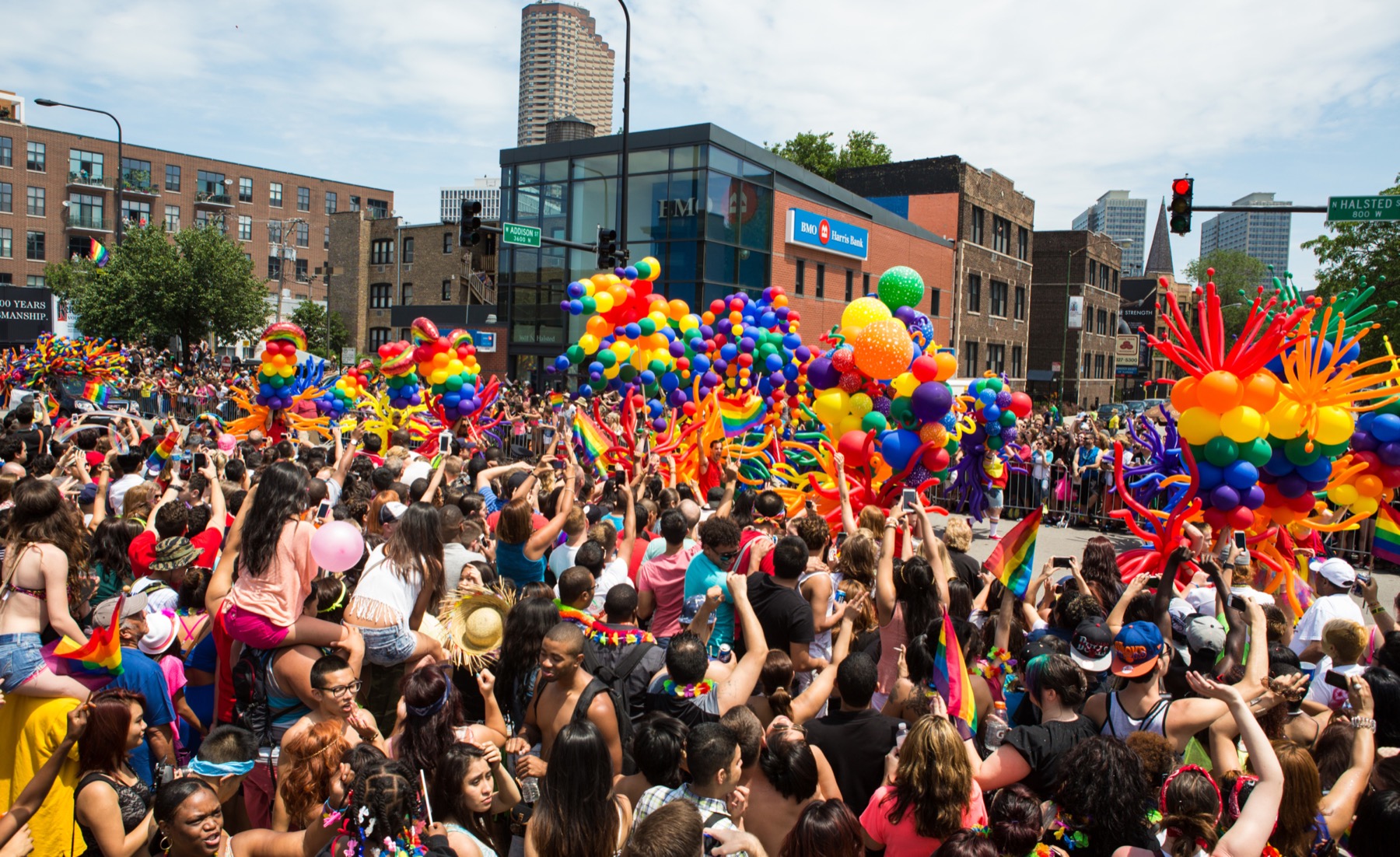Parade marchers wil rainbow balloons at the Chicago Pride Parade