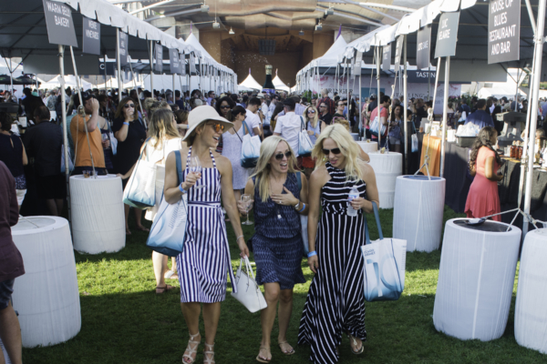 Women talking while browsing Chicago Gourmet