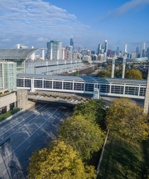 McCormick Place with Chicago’s skyline in the distance. A premier convention hub with hotels, dining, and attractions nearby.