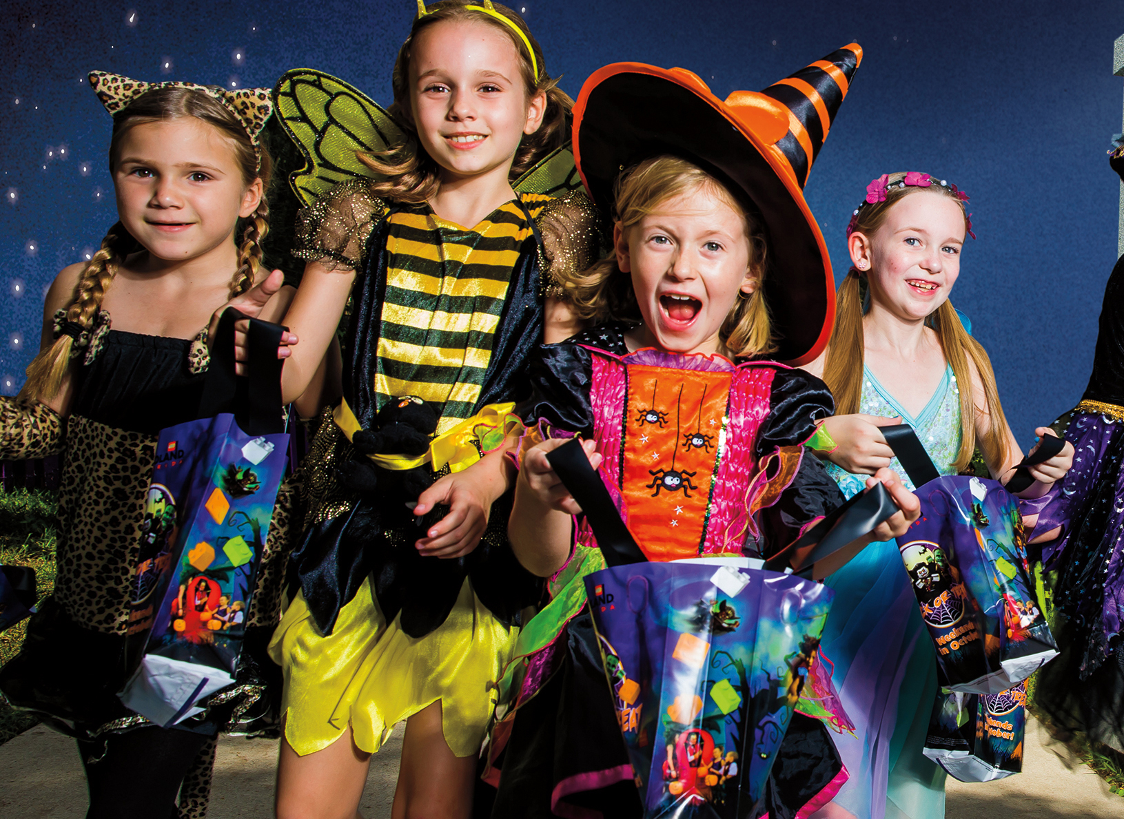 Kids modeling in Halloween costumes for Brick-or-Treat in Chicago