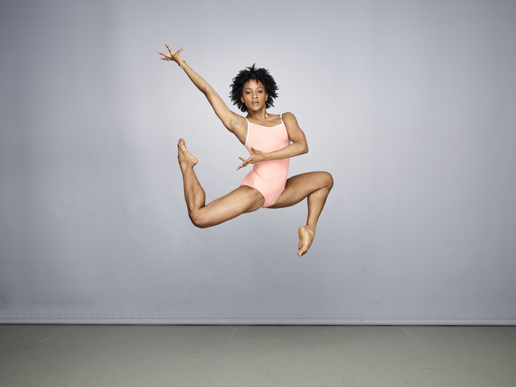 Alvin Ailey jumping in the air at the American Dance Theater