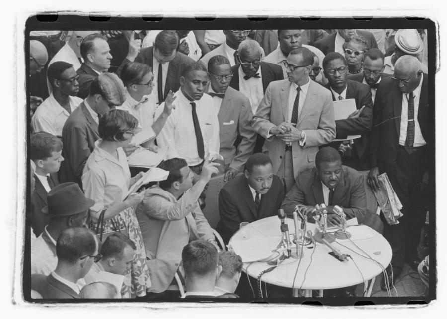 Dr. Martin Luther King Jr. and Rev. Ralph Abernathy at press conference outside Gaston Hotel