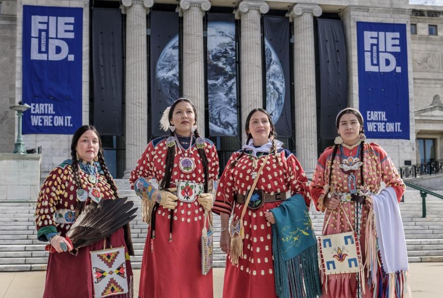 Photograph taken on the Field Museum’s North steps of Apsáalooke Women and Warriors exhibition contributors including Phenocia Bauerle, Charmaine Hill, exhibition curator Nina Sanders, and JoRee LaFrance.