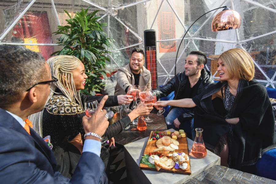 A group enjoys wine inside a City Winery dome on the Chicago Riverwalk