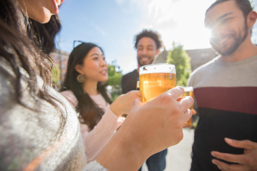 People drinking cider on Eris patio