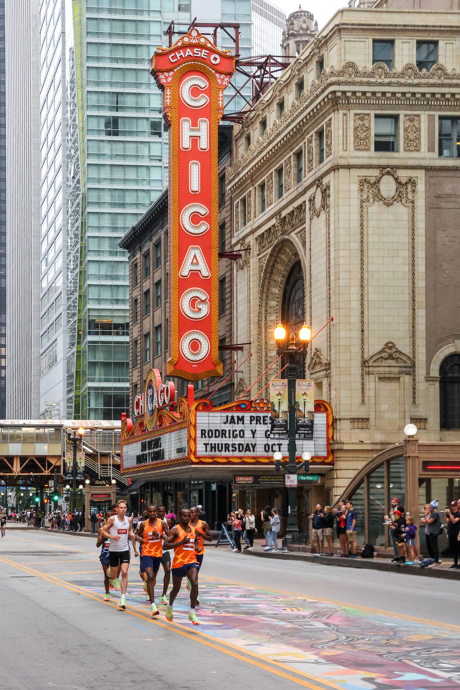 Chicago Marathon runners by the Chicago Theatre