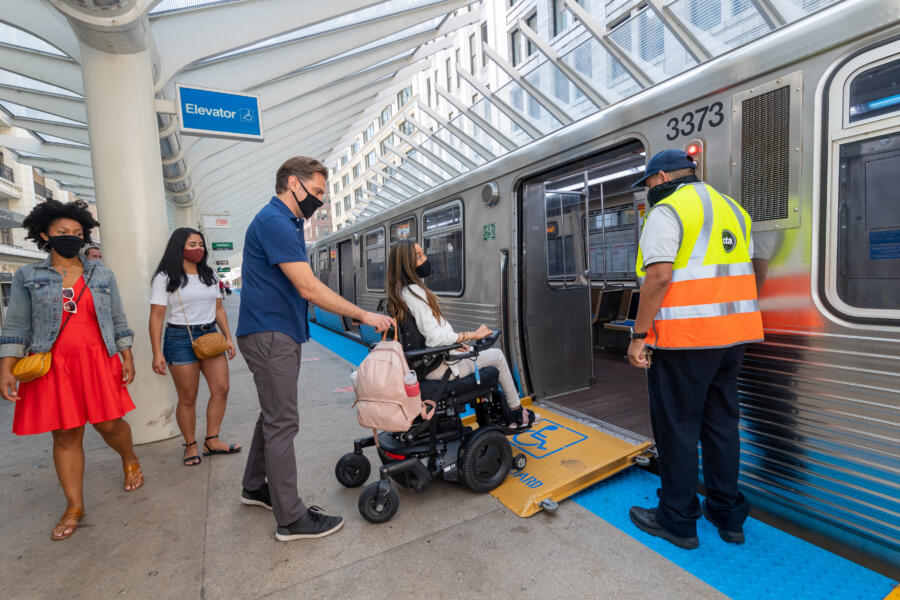 A visitor in a wheelchair at the Chicago CTA station