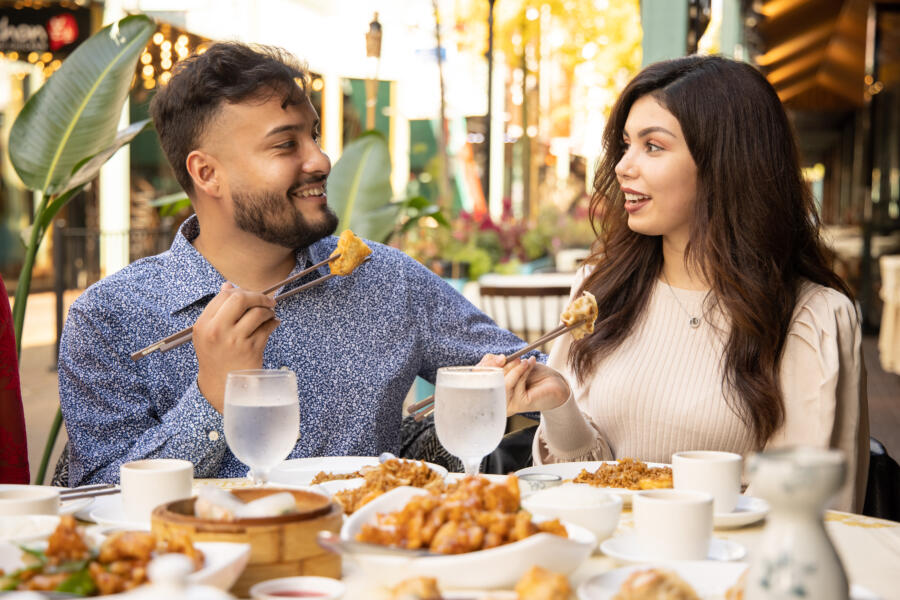 Friends eat outside at Ming Hin in Chicago's Chinatown