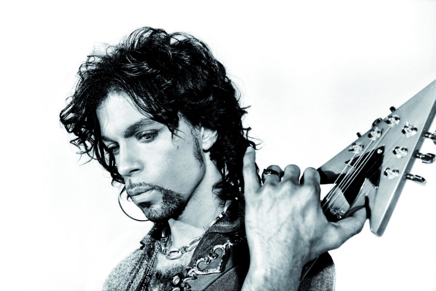 Prince plays the guitar