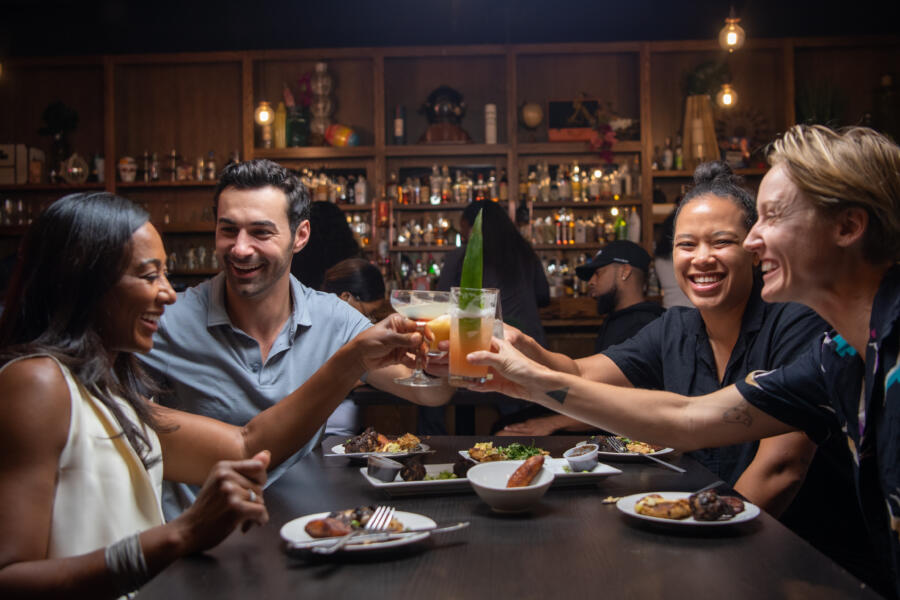 Friends cheers cocktails at 14 Parish