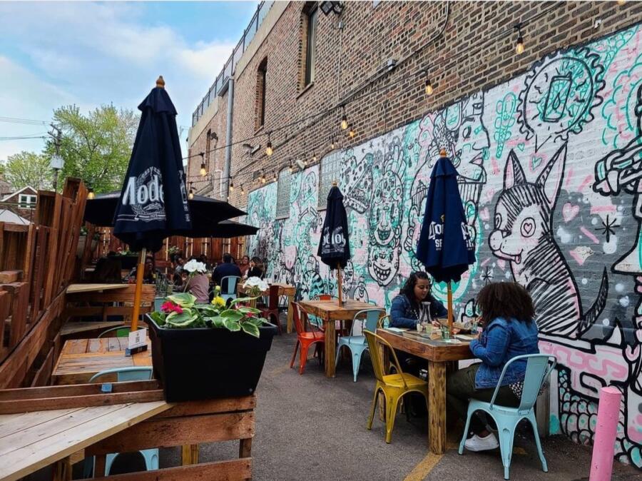 Osito's Tap patio with a black and white mural