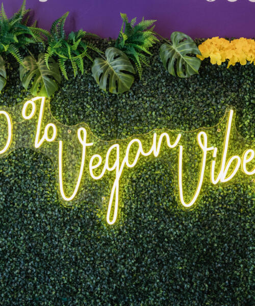 A neon sign at Soul Veg City in Greater Grand Crossing