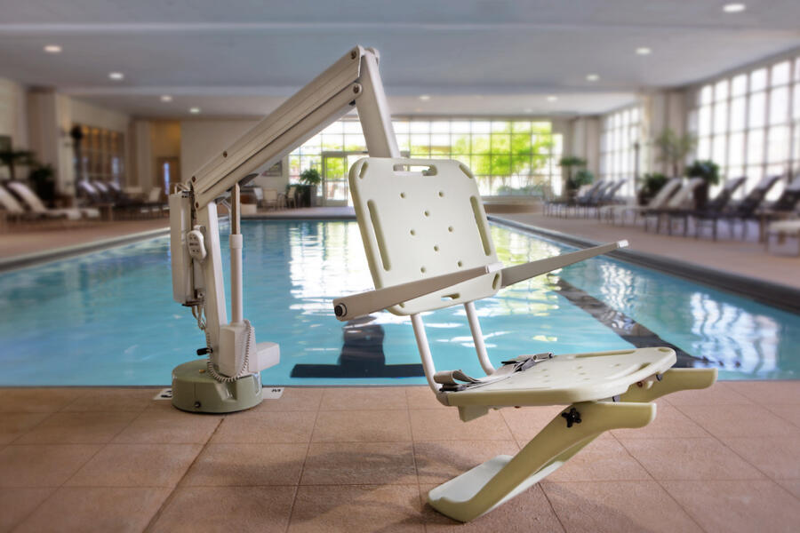 A pool lift designed to help those with mobility issues enter and exit the indoor pool.