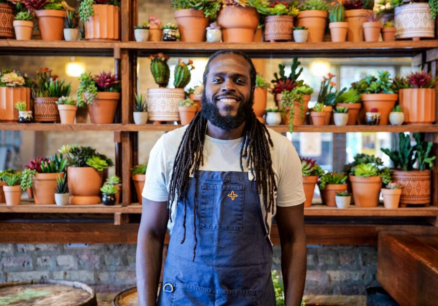 Executive chef Brian Jupiter standing inside the Frontier restaurant in West Town, Chicago