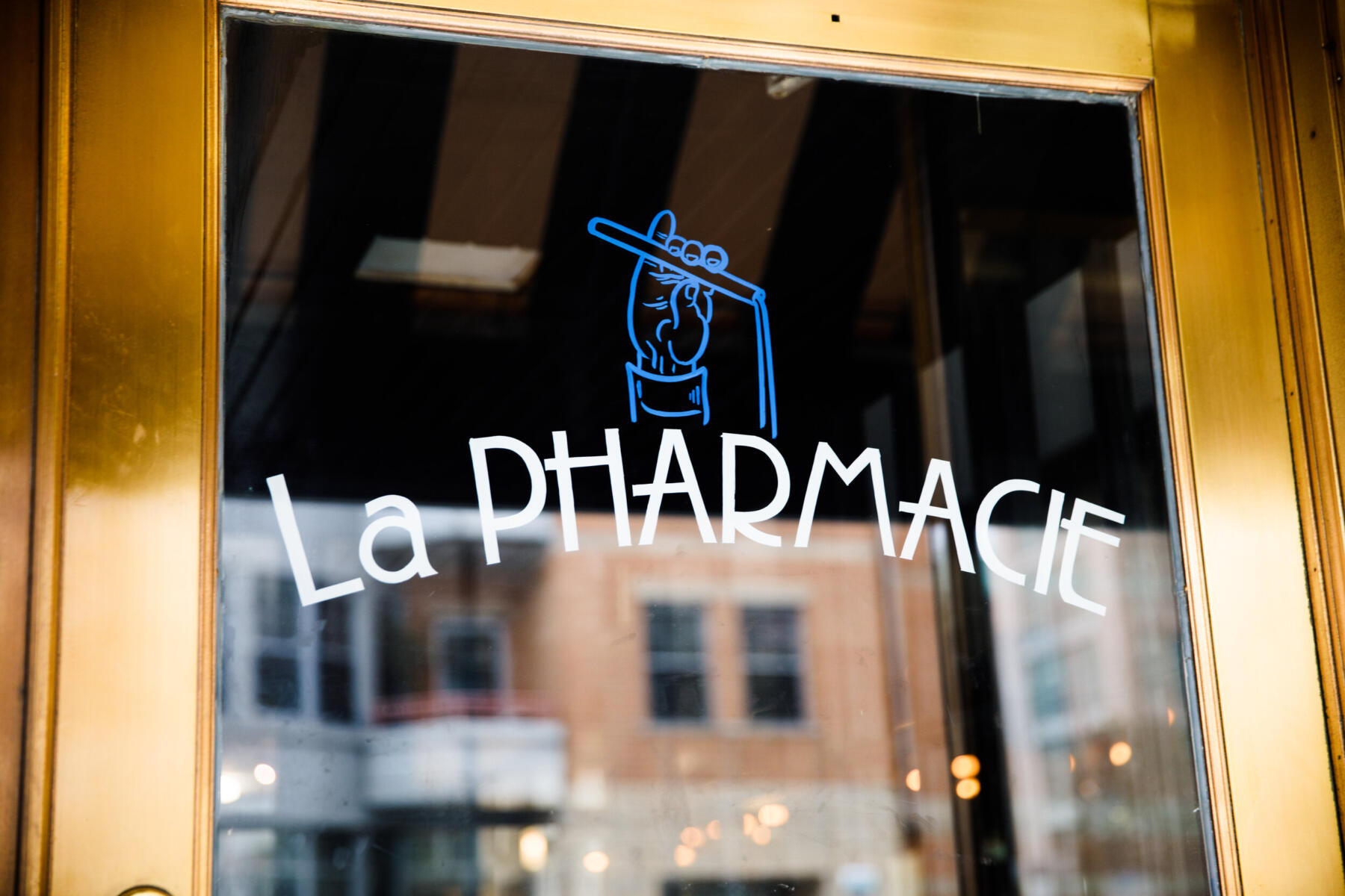 The front door of La Pharmacie in Edgewater