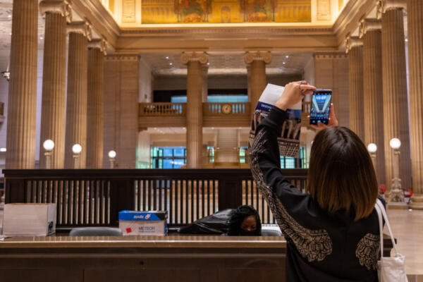 A woman takes a picture at Open House Chicago