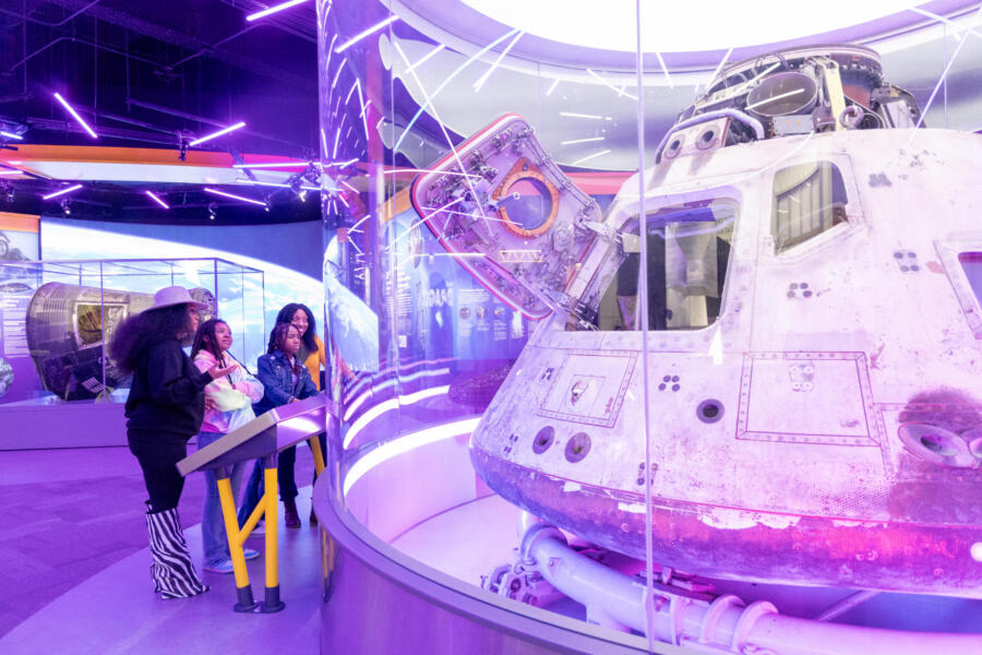A family of four enjoys a unique and fun exhibit at the Museum of Science and Industry.