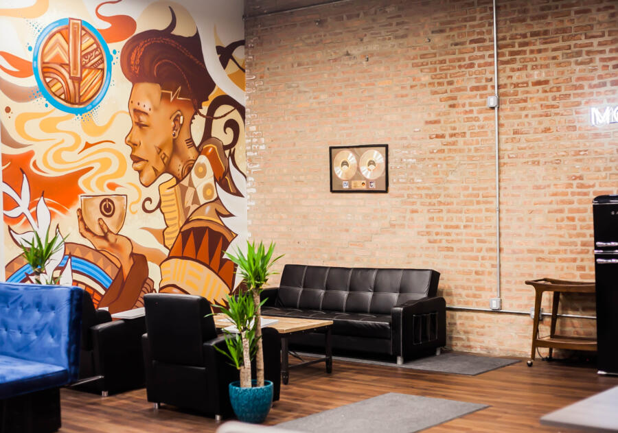 The interior of Momentum Coffee in Chicago, with a mural and seating area