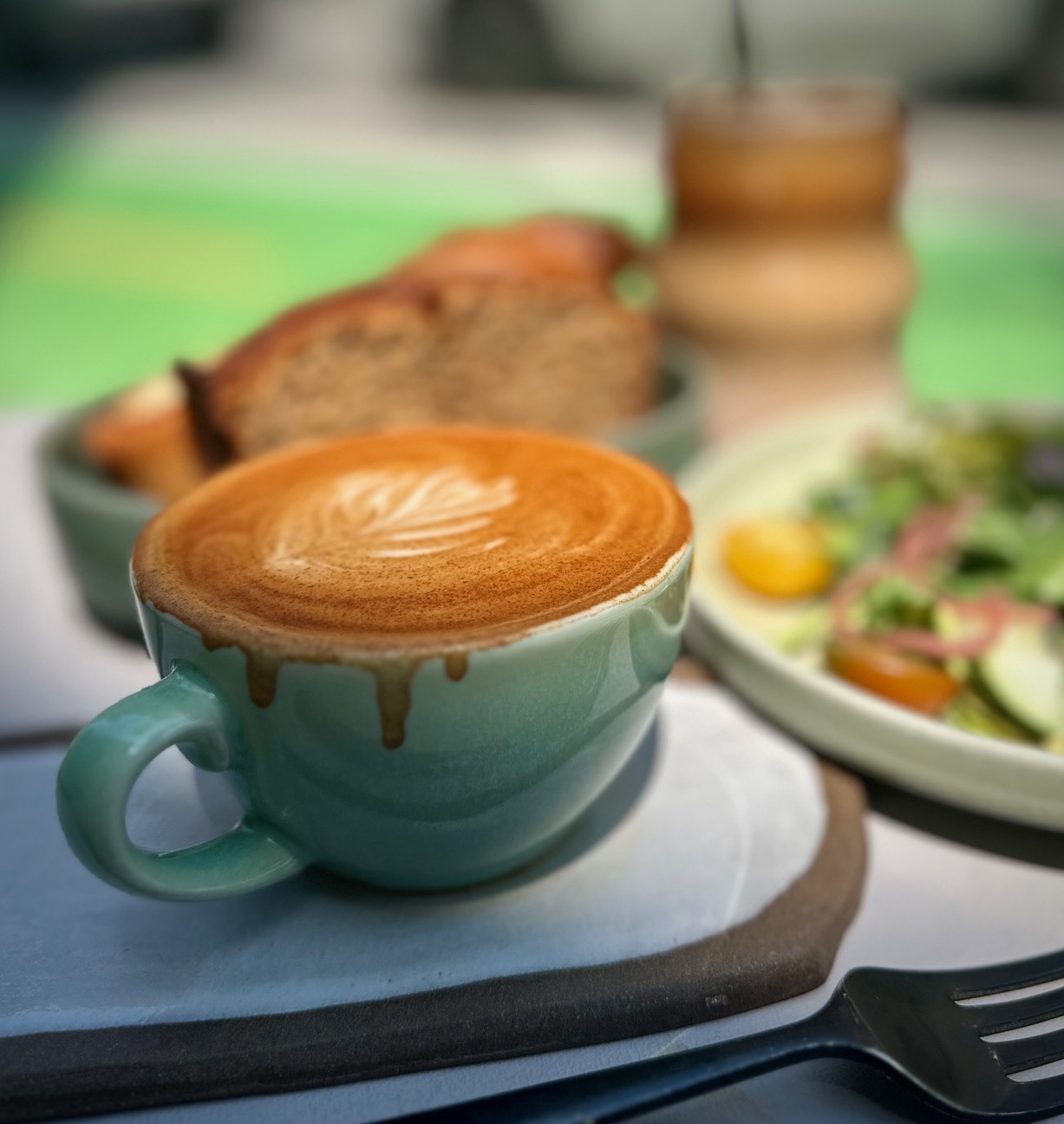 A latte at necessary & sufficient coffee