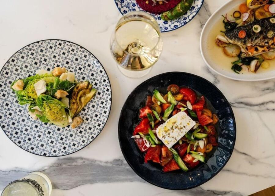 Plates of food at Laurel restaurant inside The Talbott Hotel