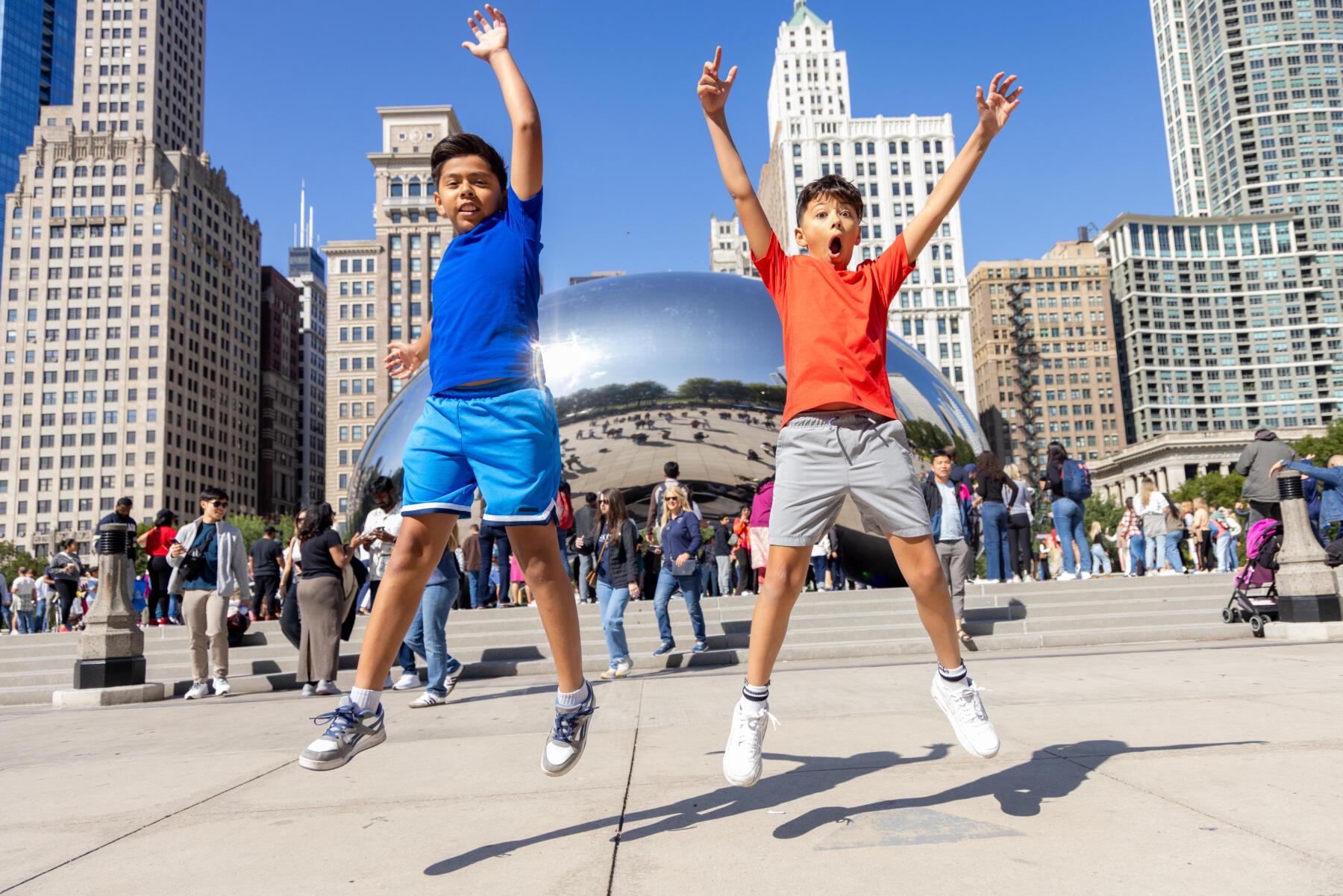 Kids run and play at The Bean in Chicago