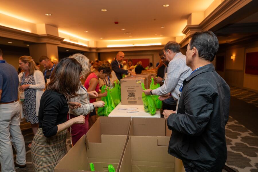 Volunteers pack food bags at Hilton Chicago
