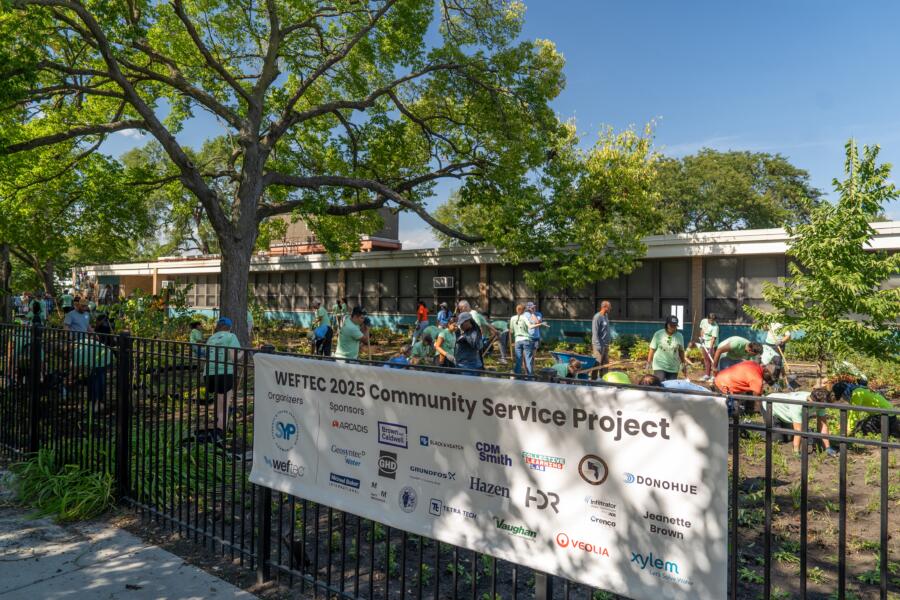 Volunteers work to install a garden at Aldridge Elementary School