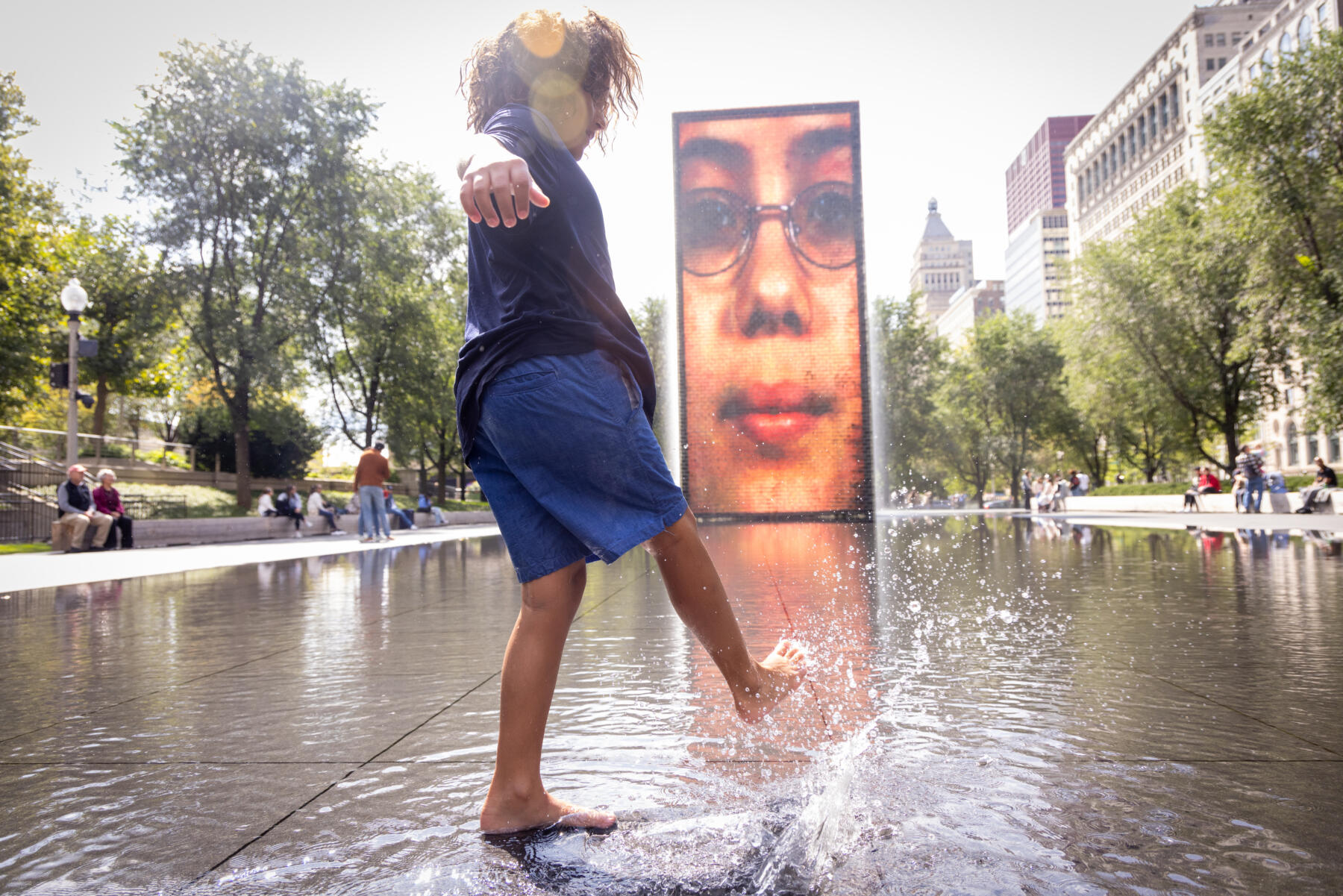 Kids play in Crown Fountain in Millennium Park