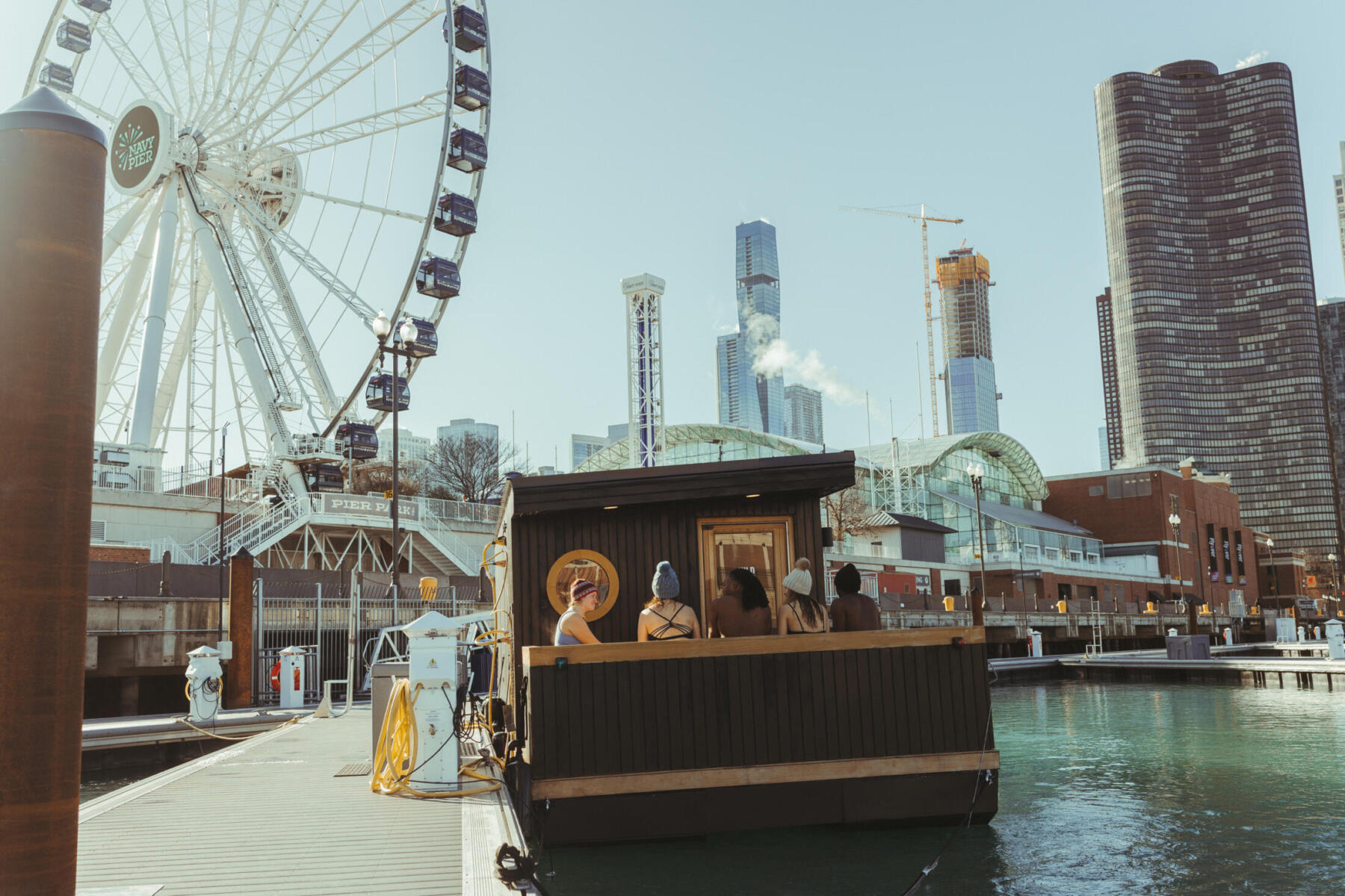 Kiln Floating Sauna with Navy Pier in the background