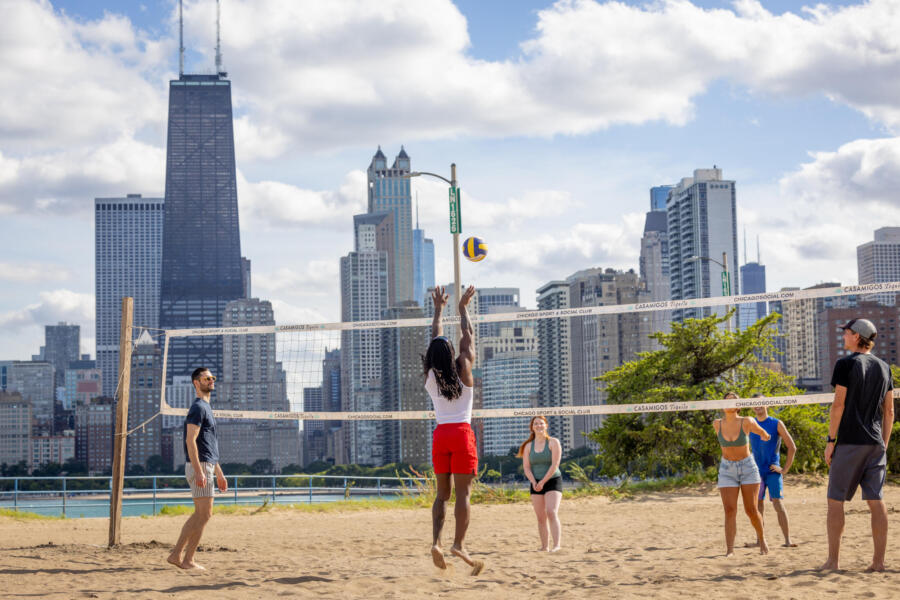 A group of friends play volleyball at North Avenue Beach