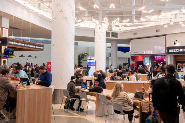 Travelers rlelax. work and eat before and after flights at Midway Central Market
