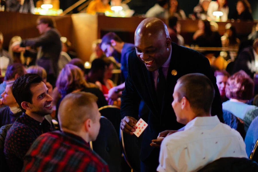 Benjamin Barnes performs table magic at the Chicago Magic