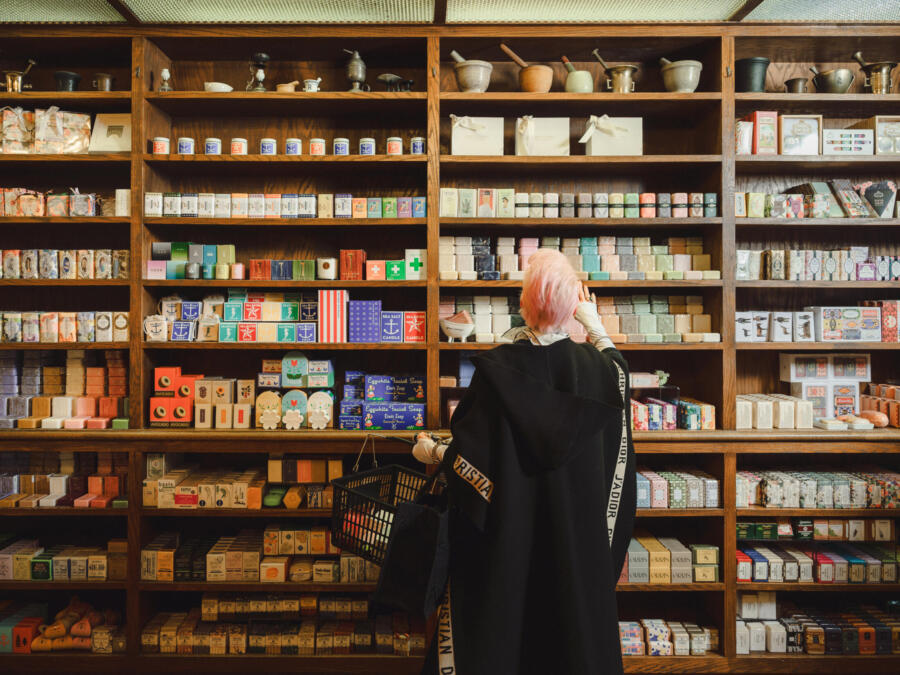 A customer shops Merz’s iconic soap wall. Chicago, IL.